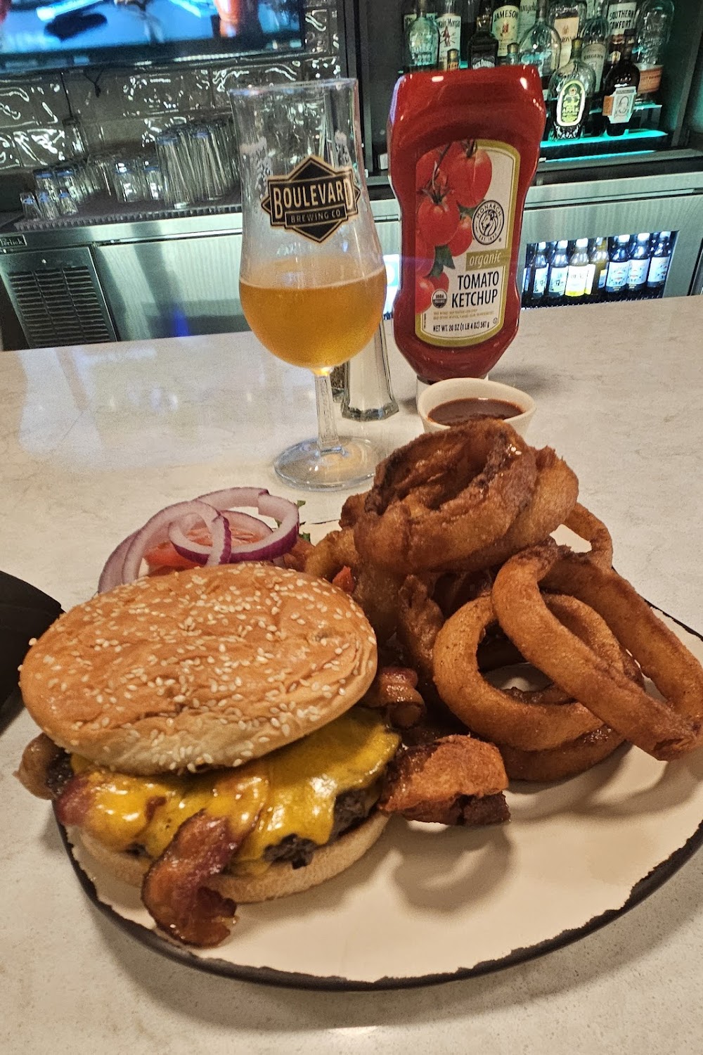 Toast to Toast Kansas City Downtown signature dishes All-American BurgerTurkey ClubMeat Lovers Flatbread